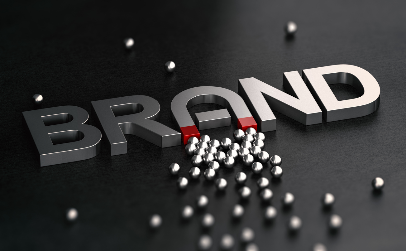 The word "Brand" has an A like a magnet attracting metal spheres